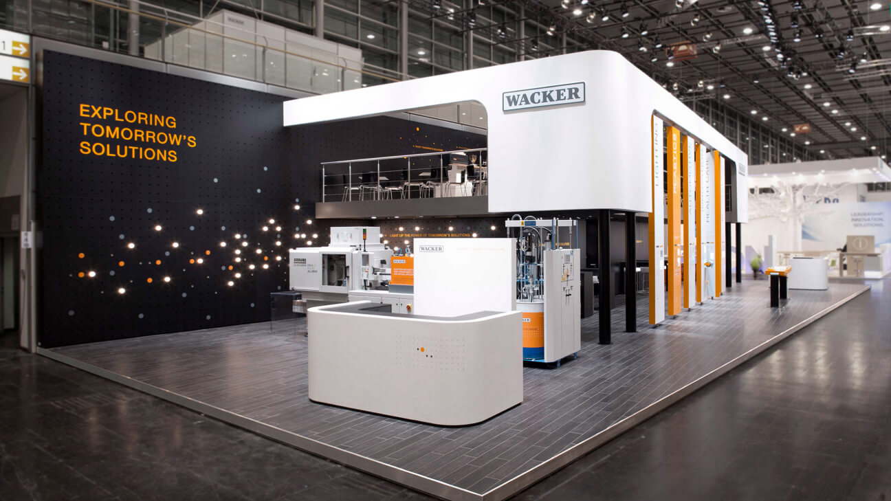 Wacker exhibition stand, full picture front side, slogan 'Exploring Tomorrow's Solutions'